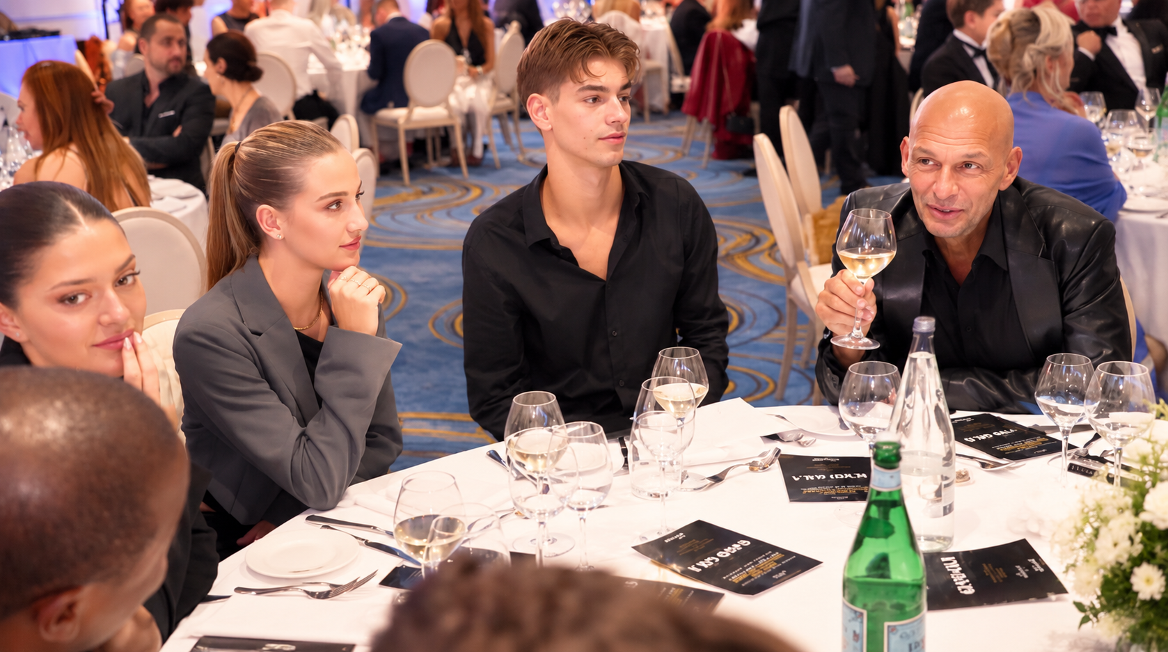 Guests gathered around a table at the Summit gala dinner