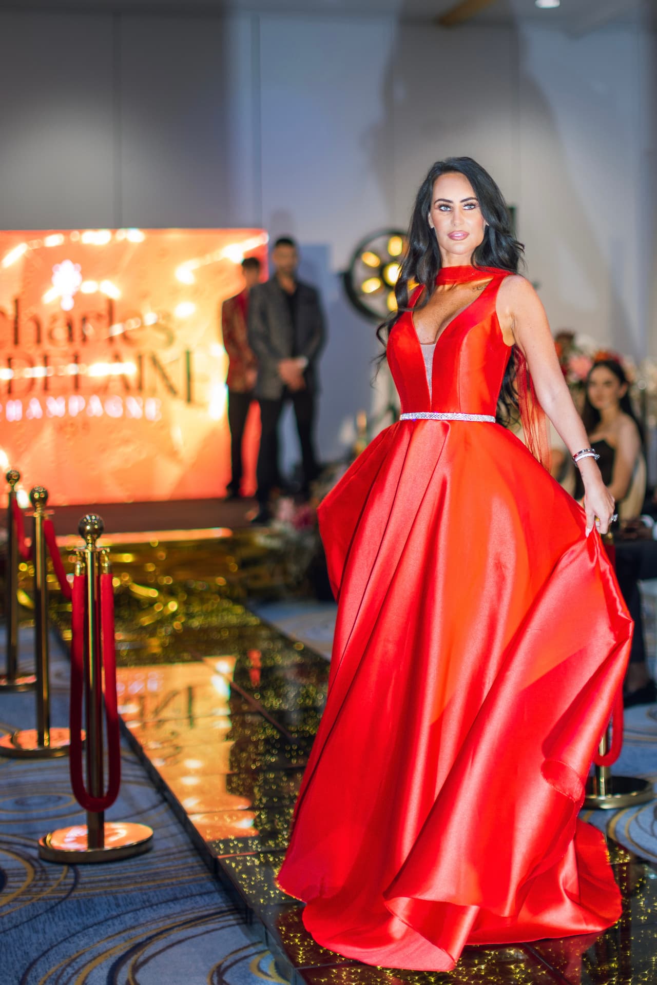 Model in a red gown on the Summit runway