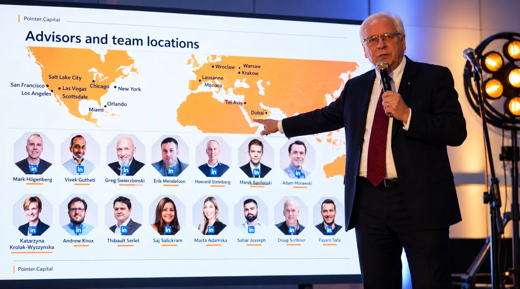 Speaker presenting advisors and team locations on the Summit screen