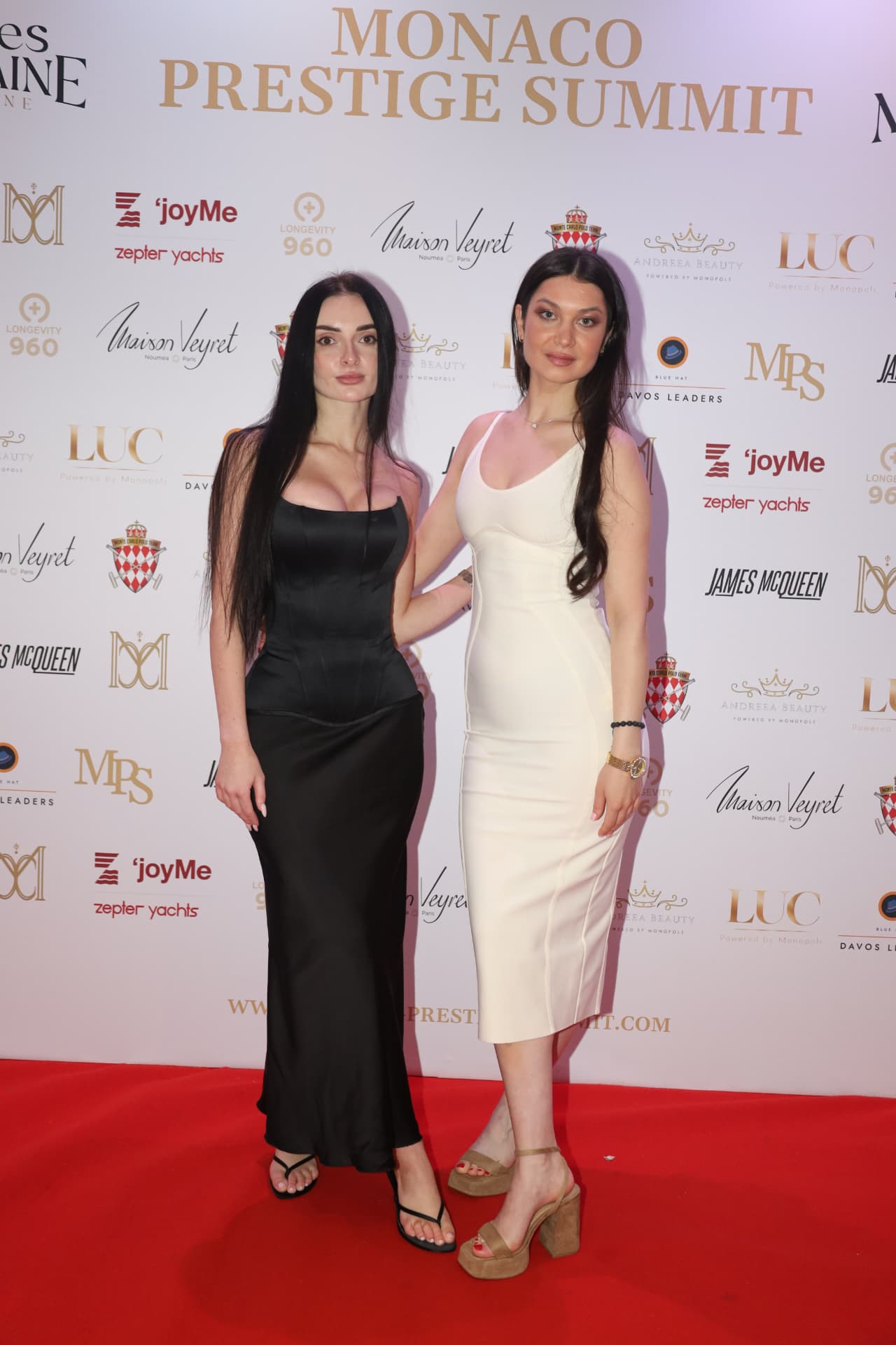 Two guests on the red carpet at the Monaco Prestige Summit