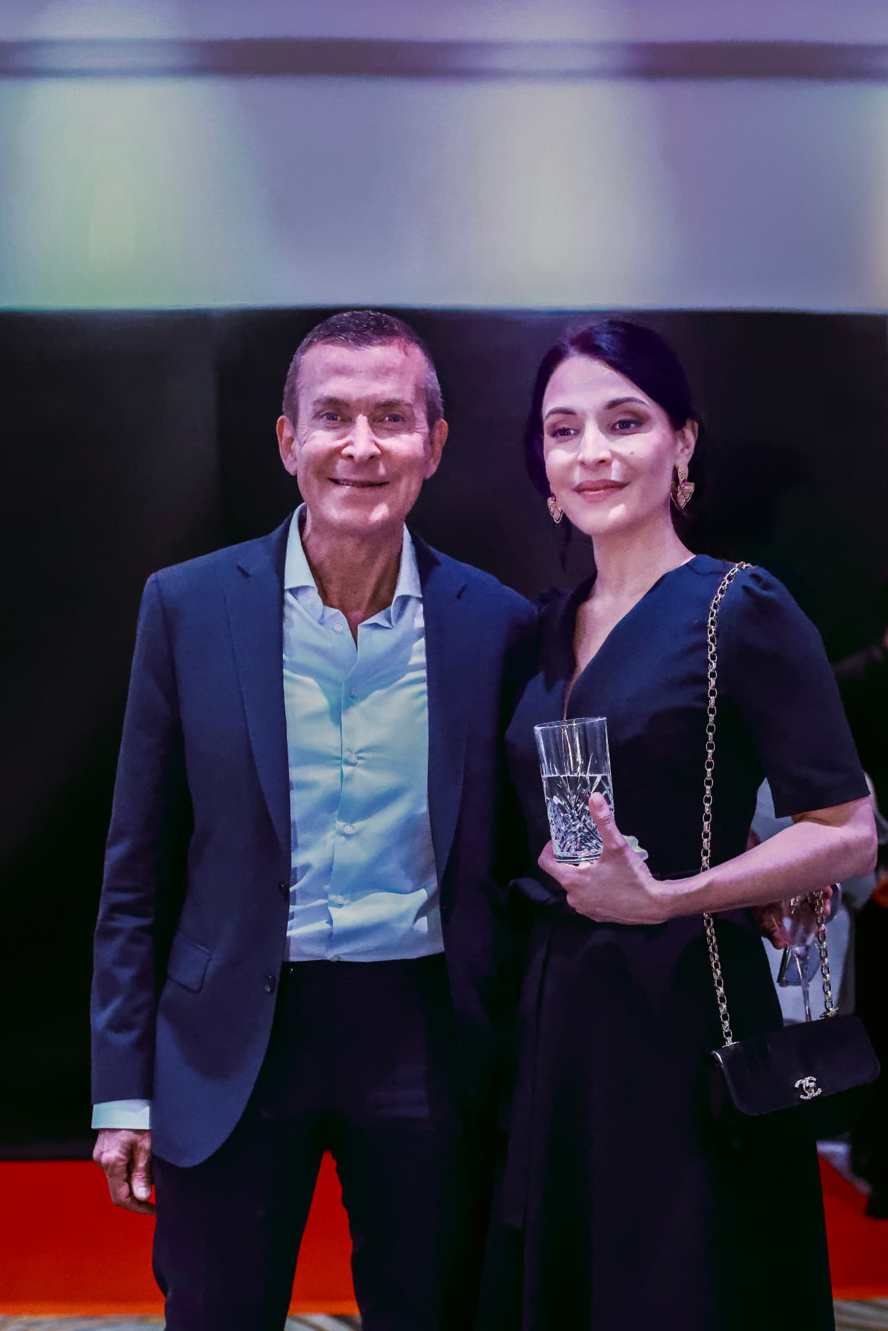 Two guests posing at the Summit reception